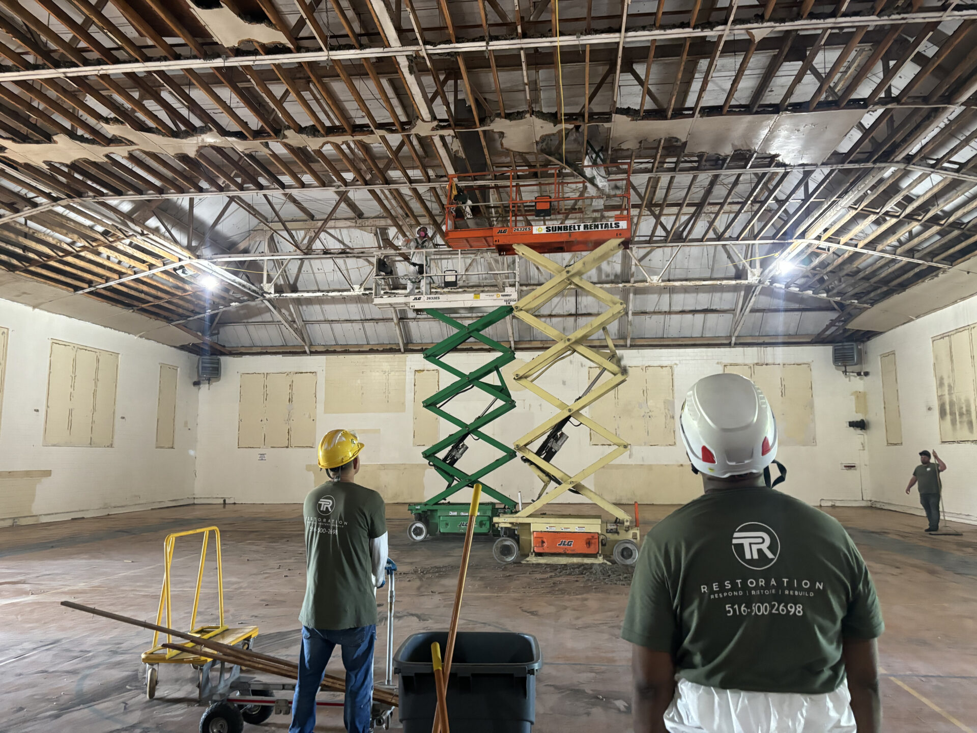 Two men in a room with some equipment